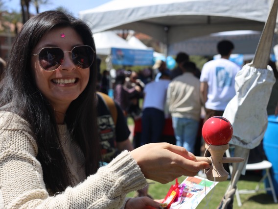 Student playing kendama